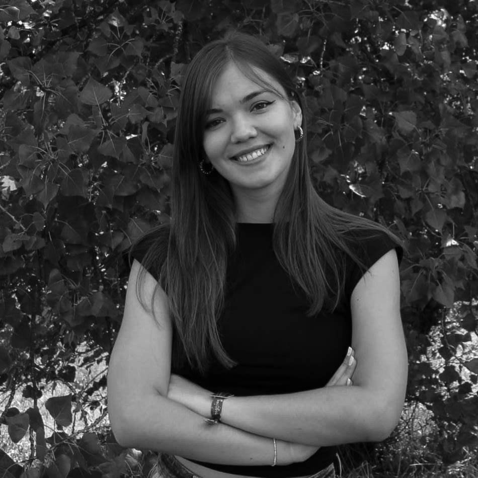 woman wears black long-sleeved dress